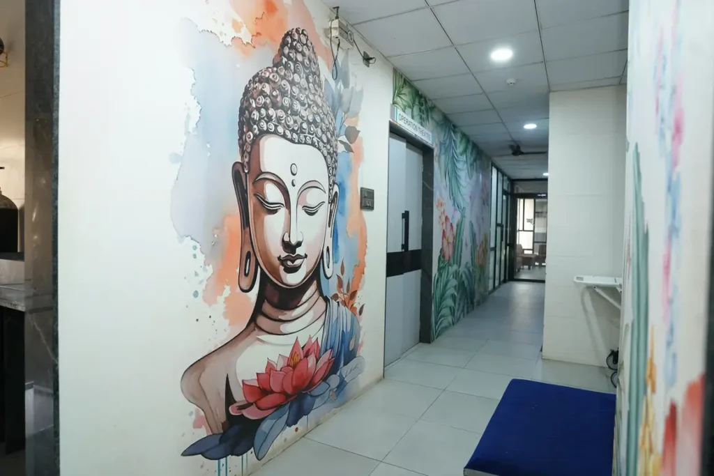 Hallway with Buddha mural at iSHA Women’s Hospital & IVF Centre, Vapi, Gujarat